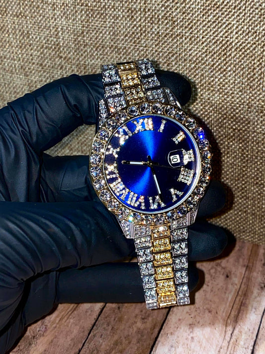 Blue dial Roman numeral iced watch with two-tone bracelet and crystal bezel – luxury streetwear look