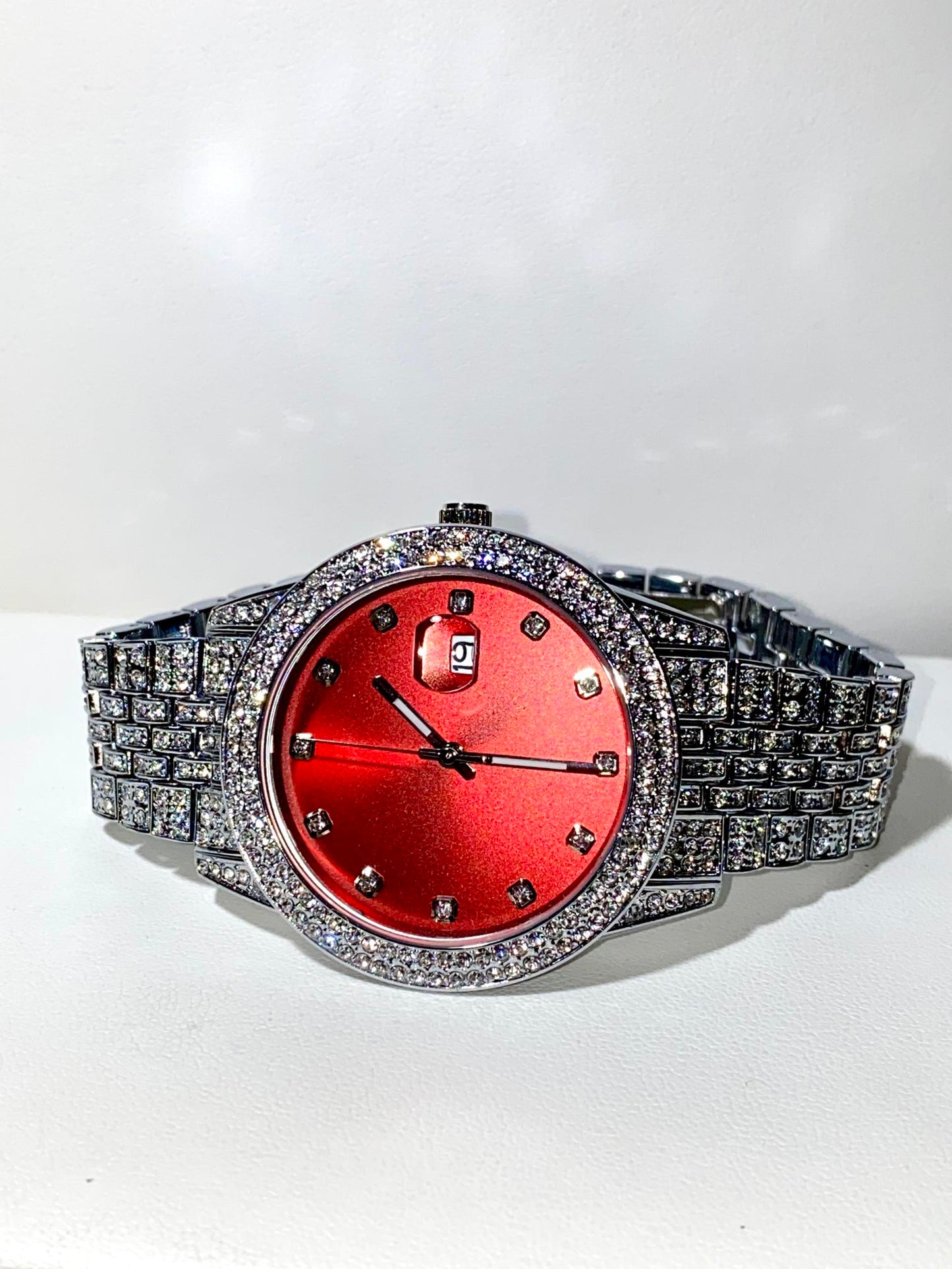 Iced-out 42MM silver watch with bold red dial and crystal bracelet – urban luxury style