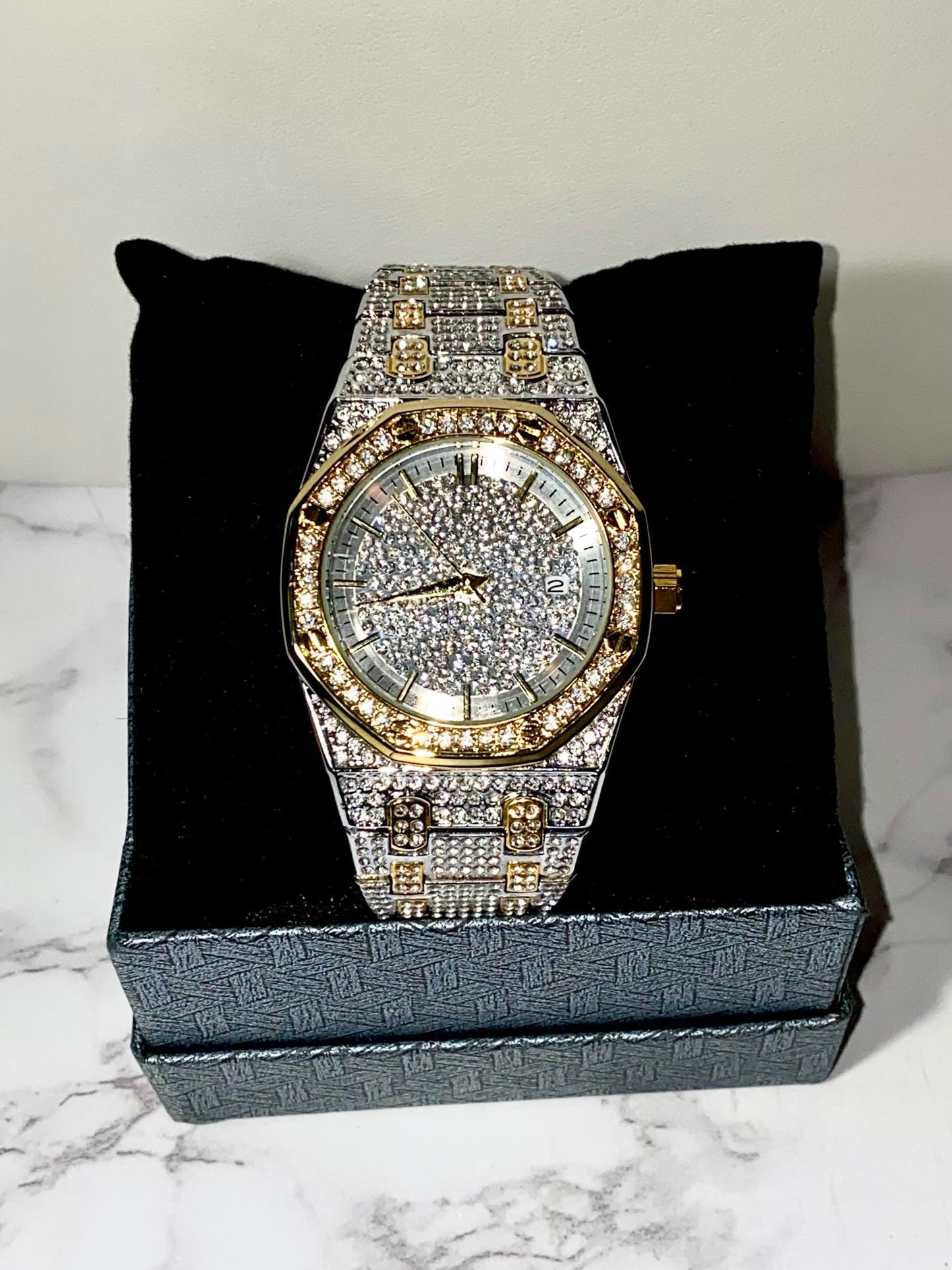 Two-tone silver and gold men's and women's watch with a diamond-studded dial and bezel. The watch features a sparkling design with crystal-encrusted links on the band, offering a luxurious, eye-catching appearance.