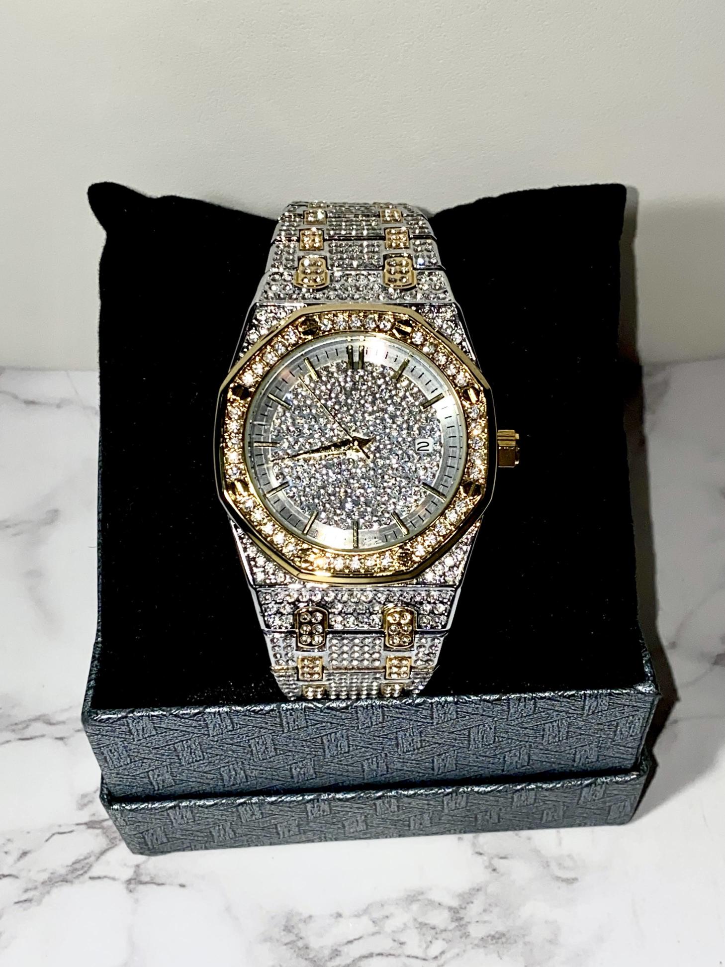 Two-tone silver and gold men's and women's watch with a diamond-studded dial and bezel. The watch features a sparkling design with crystal-encrusted links on the band, offering a luxurious, eye-catching appearance.