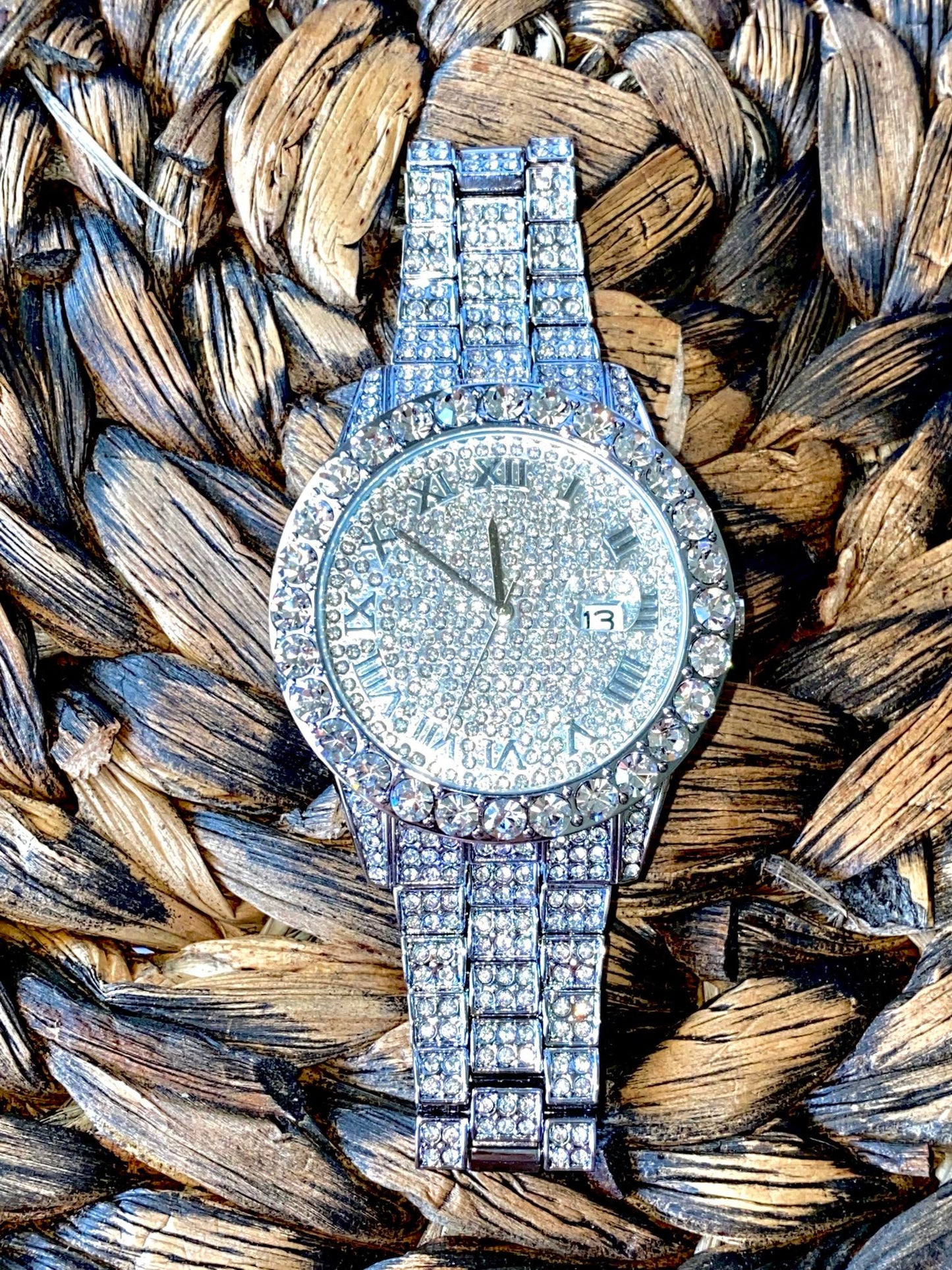 Silver iced-out watch with Roman numeral pavé dial and diamond bracelet – luxury streetwear timepiece