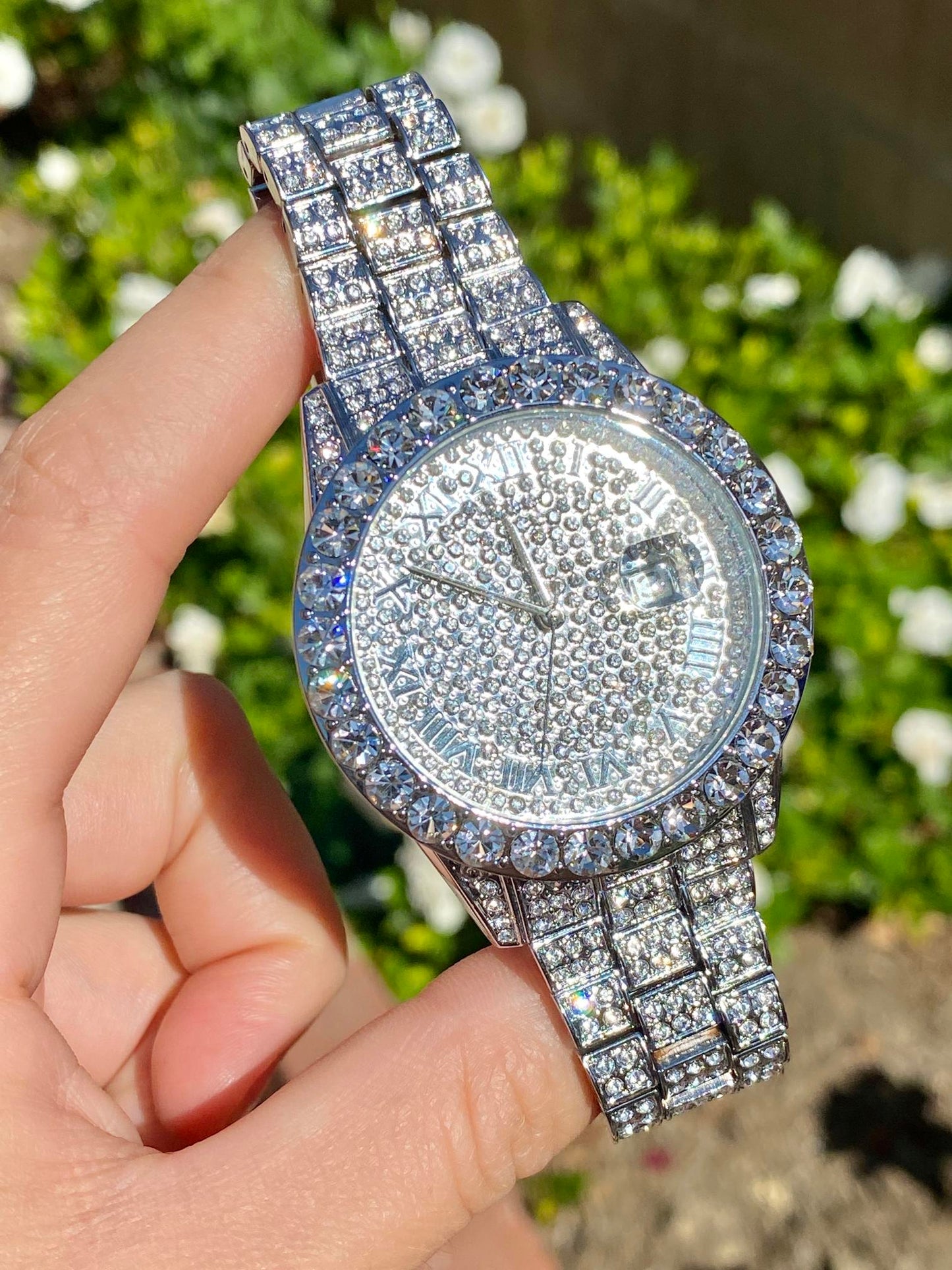Silver iced-out watch with Roman numeral pavé dial and diamond bracelet – luxury streetwear timepiece
