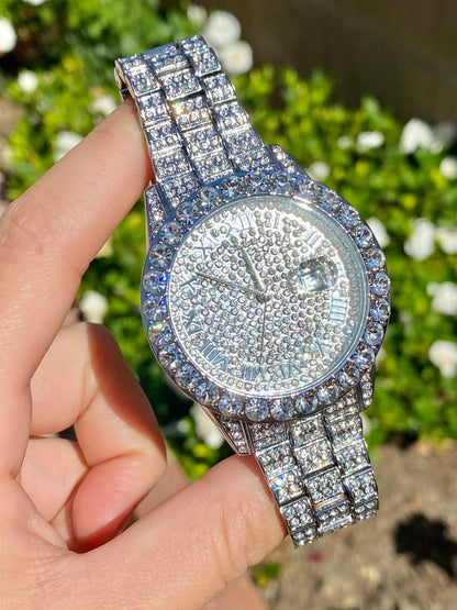 Silver iced-out watch with Roman numeral pavé dial and diamond bracelet – luxury streetwear timepiece