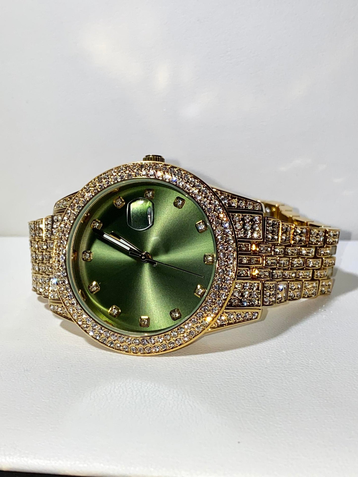 Gold iced-out 42MM watch with green dial, crystal markers, and pavé band – luxury streetwear style