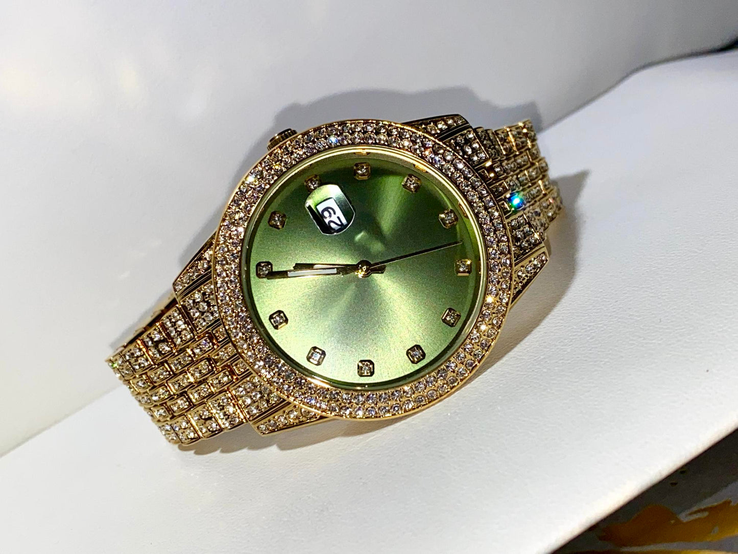 Gold iced-out 42MM watch with green dial, crystal markers, and pavé band – luxury streetwear style