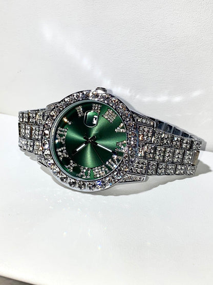 Silver iced-out watch with emerald green dial, Roman numerals, and diamond bracelet – luxury streetwear timepiece