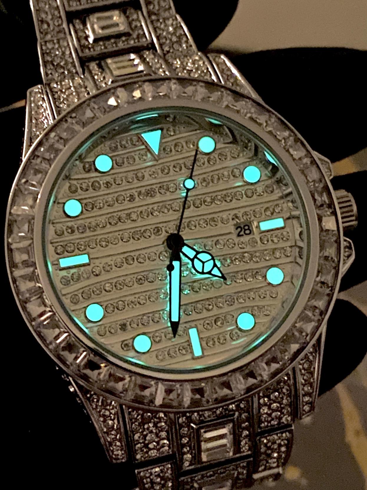 Silver iced-out watch with grid pavé dial, baguette bezel, and diamond bracelet – luxury streetwear timepiece
