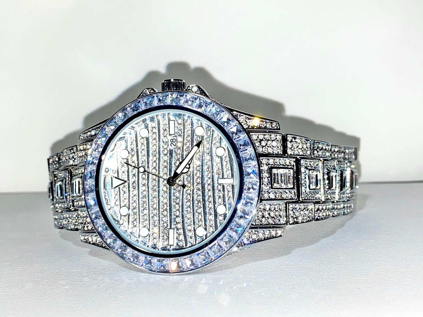 Silver iced-out watch with grid pavé dial, baguette bezel, and diamond bracelet – luxury streetwear timepiece