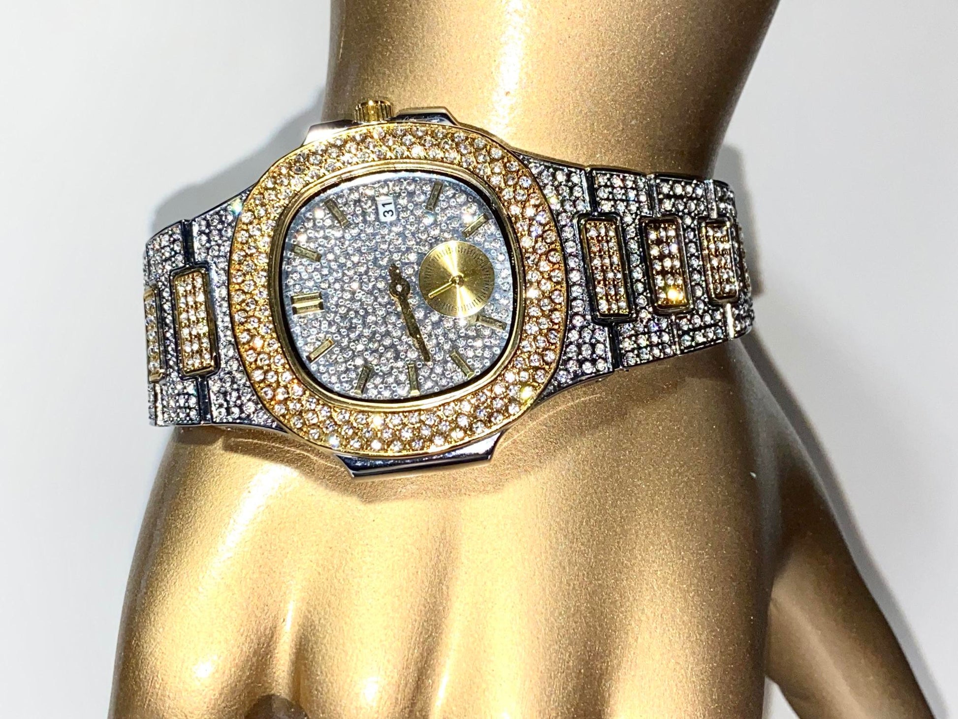 Two-tone iced-out watch with gold bezel accents, diamond pavé dial, and gold subdial – luxury streetwear style