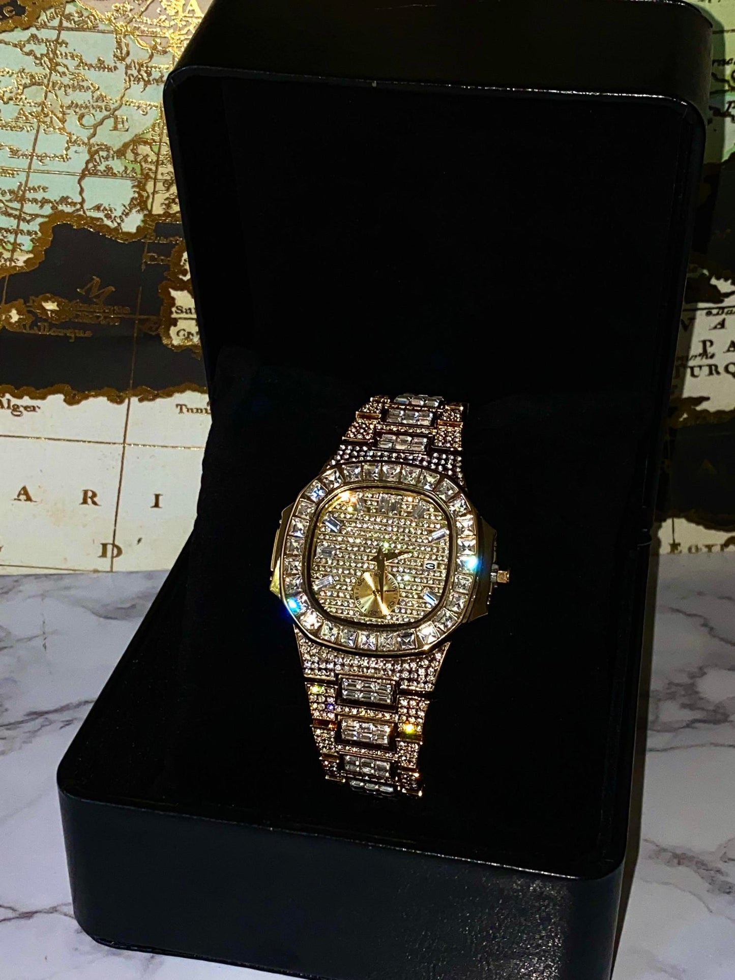 Gold iced-out watch with baguette bezel, grid pavé dial, and diamond bracelet – luxury streetwear timepiece