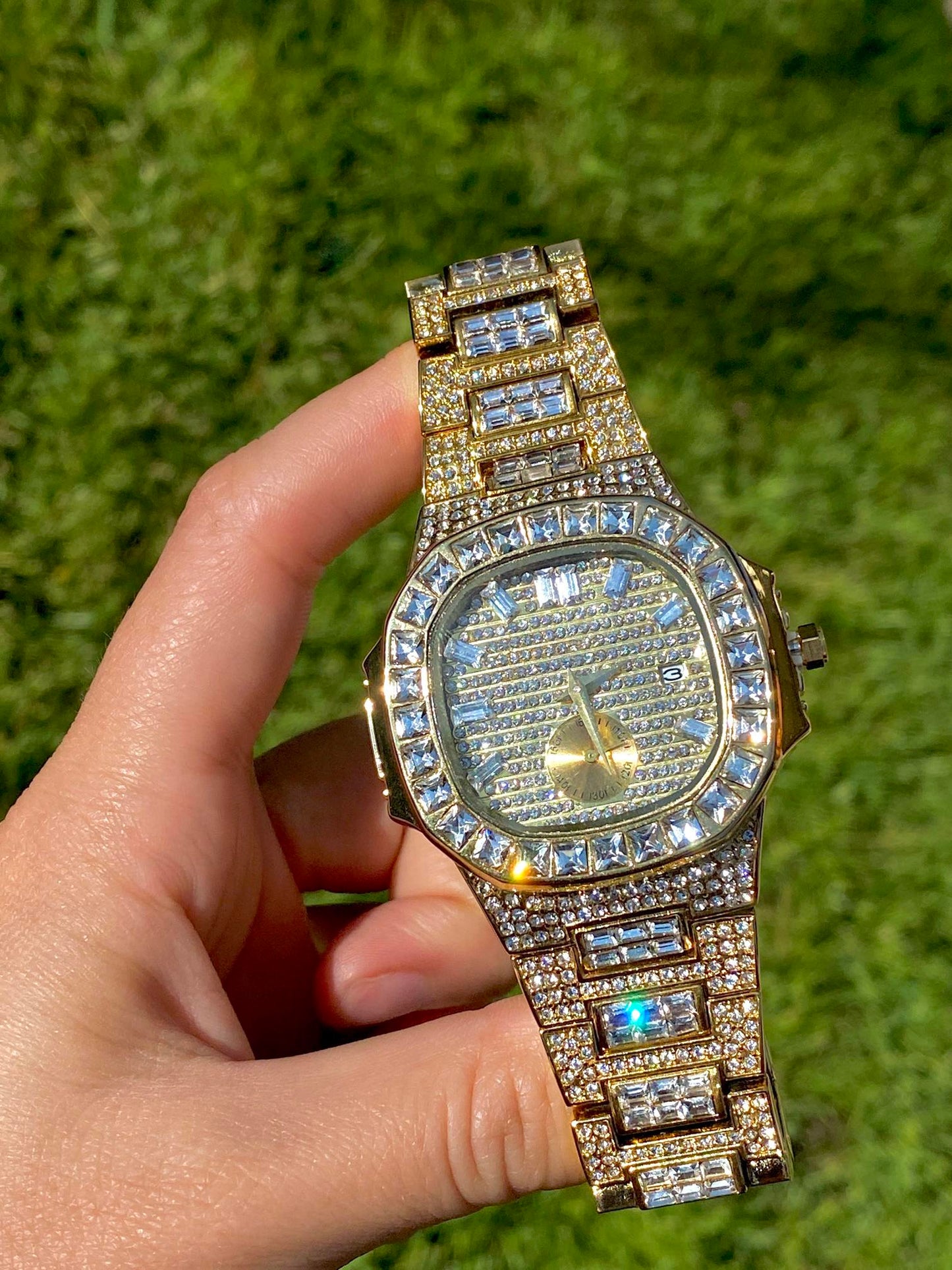 Gold iced-out watch with baguette bezel, grid pavé dial, and diamond bracelet – luxury streetwear timepiece