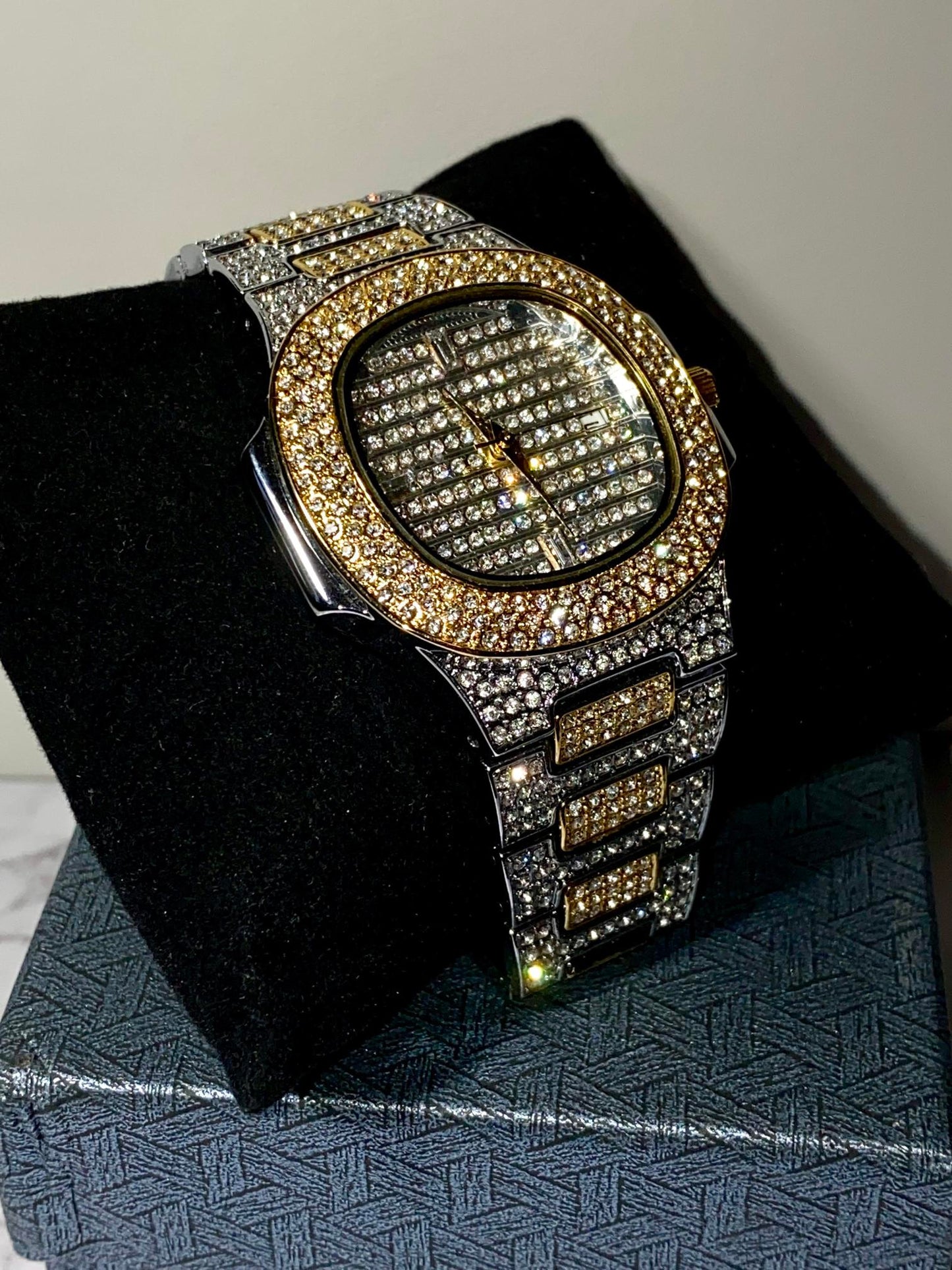 Two-tone iced-out watch with gold bezel, grid pavé dial, and diamond bracelet – luxury streetwear style