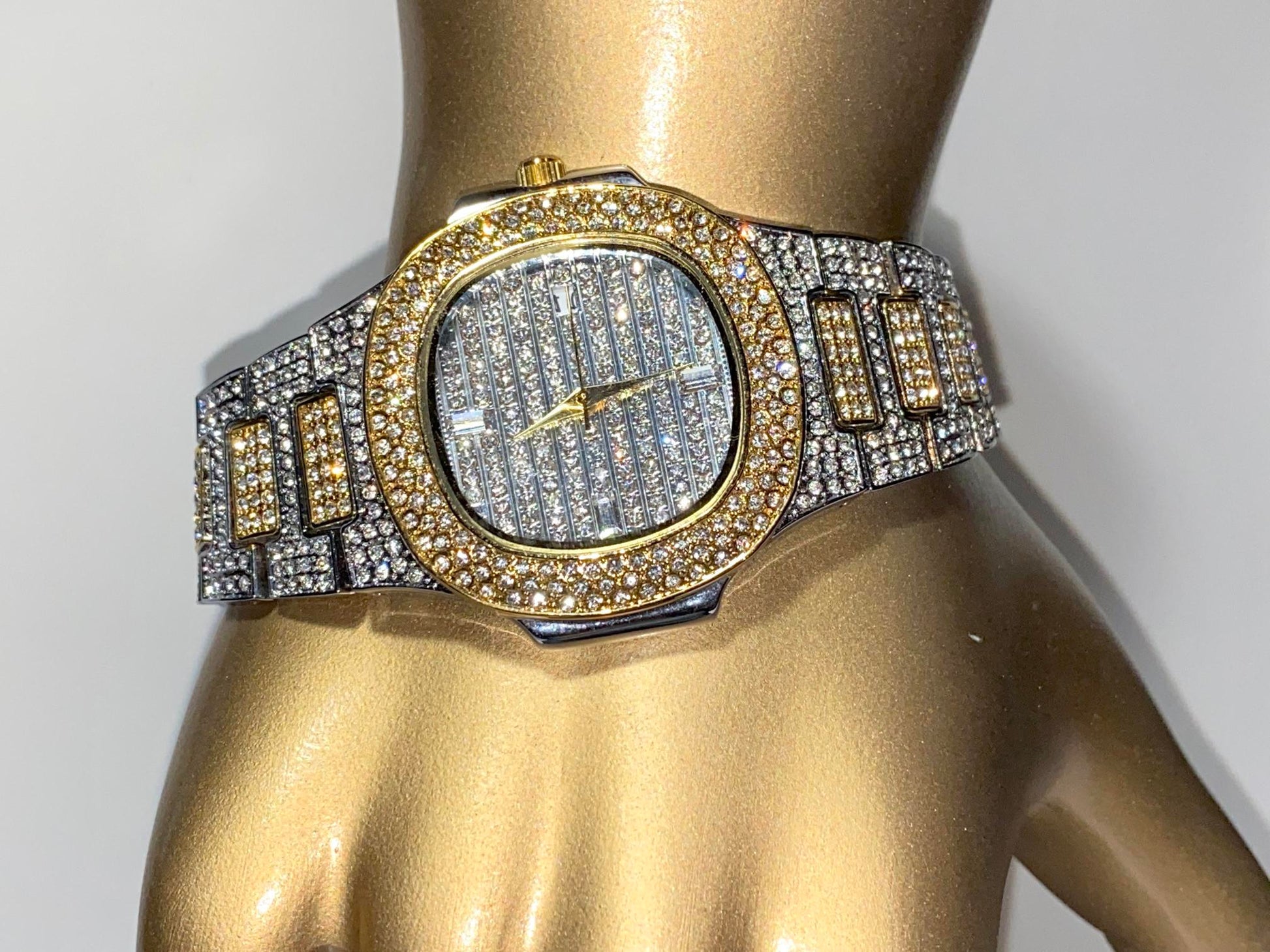 Two-tone iced-out watch with gold bezel, grid pavé dial, and diamond bracelet – luxury streetwear style