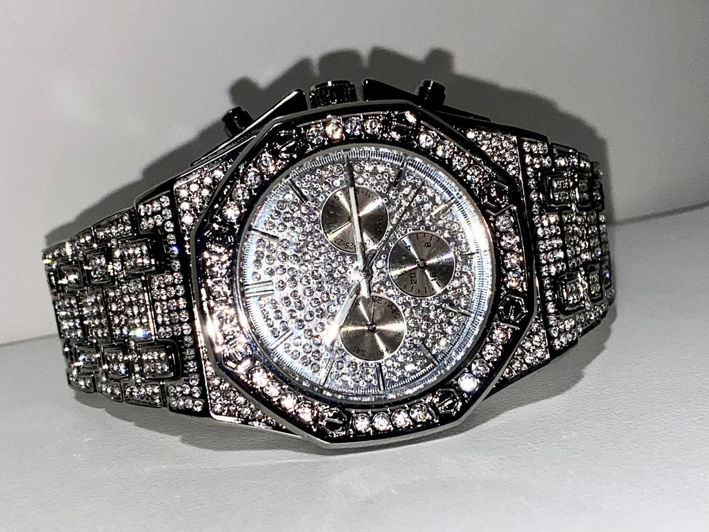 Silver iced-out octagon chronograph watch with pavé dial and diamond bracelet – luxury streetwear timepiece