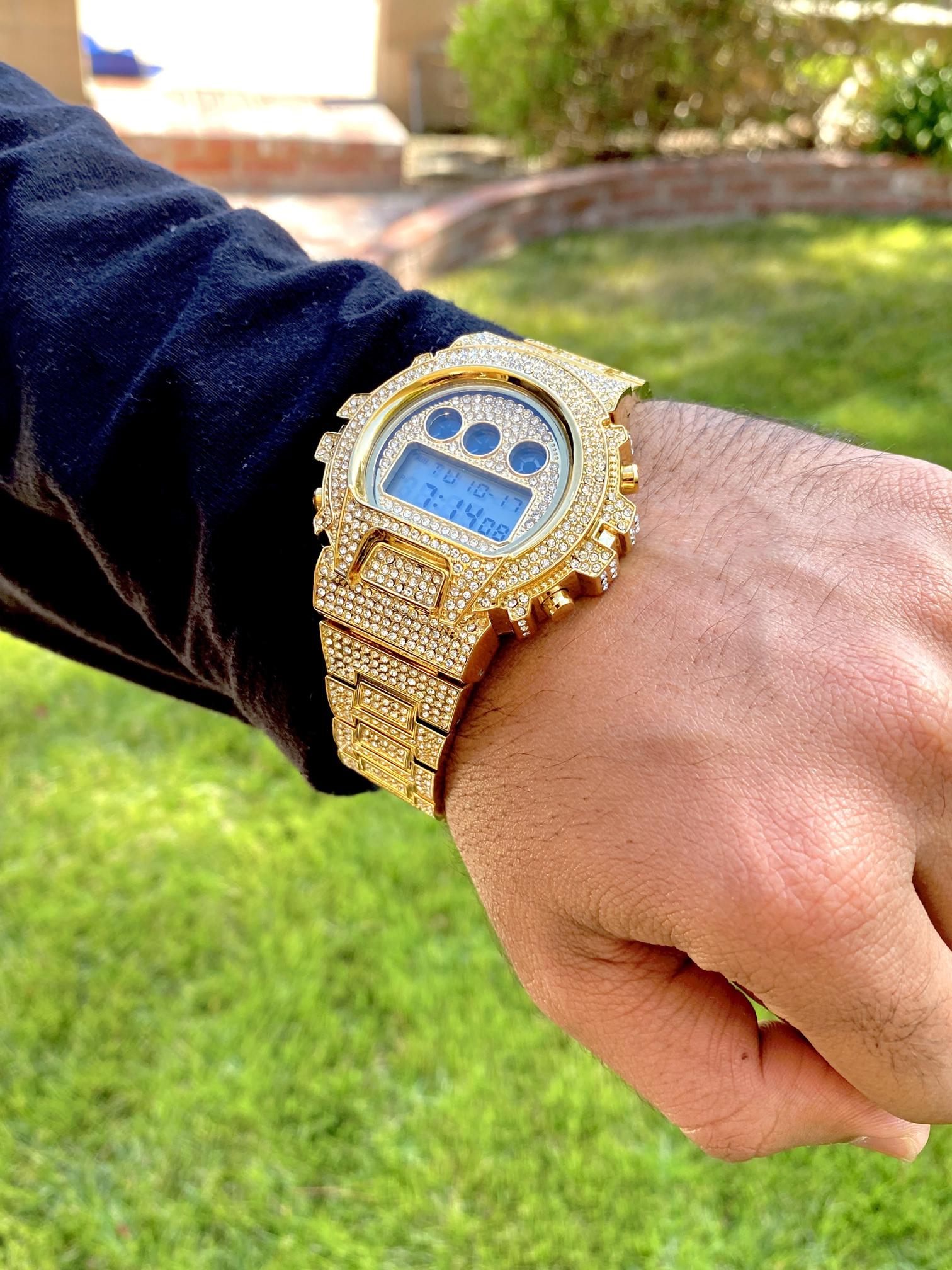 Gold iced-out digital watch with pavé bezel and bracelet – luxury tech streetwear style