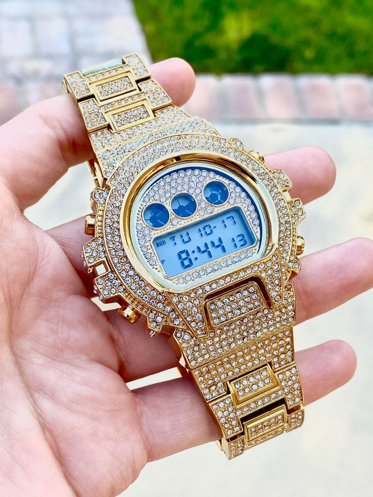 Gold iced-out digital watch with pavé bezel and bracelet – luxury tech streetwear style