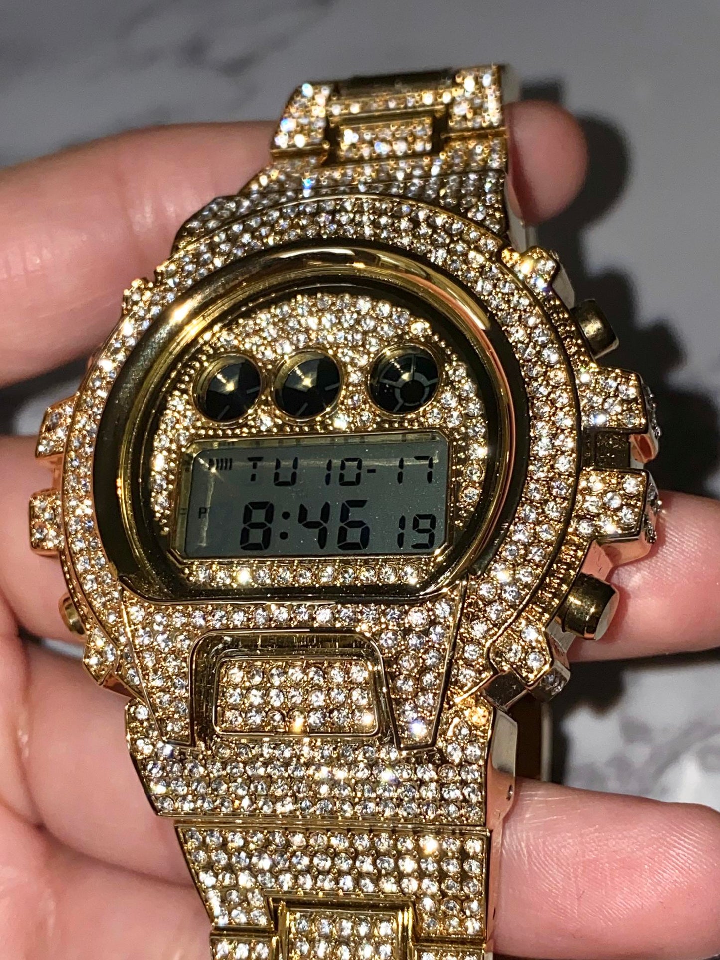 Gold iced-out digital watch with pavé bezel and bracelet – luxury tech streetwear style