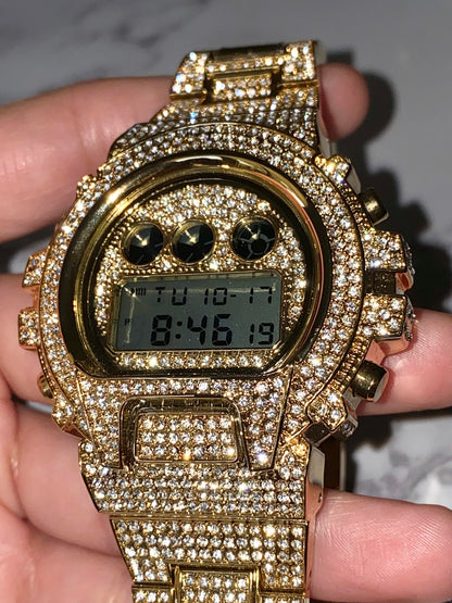 Gold iced-out digital watch with pavé bezel and bracelet – luxury tech streetwear style