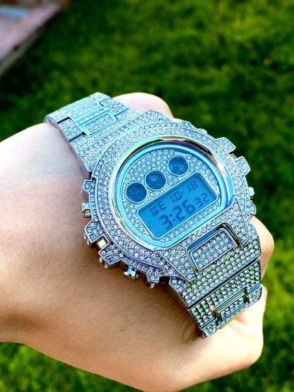 Silver iced-out digital watch with full pavé bezel and bracelet – luxury tech streetwear style