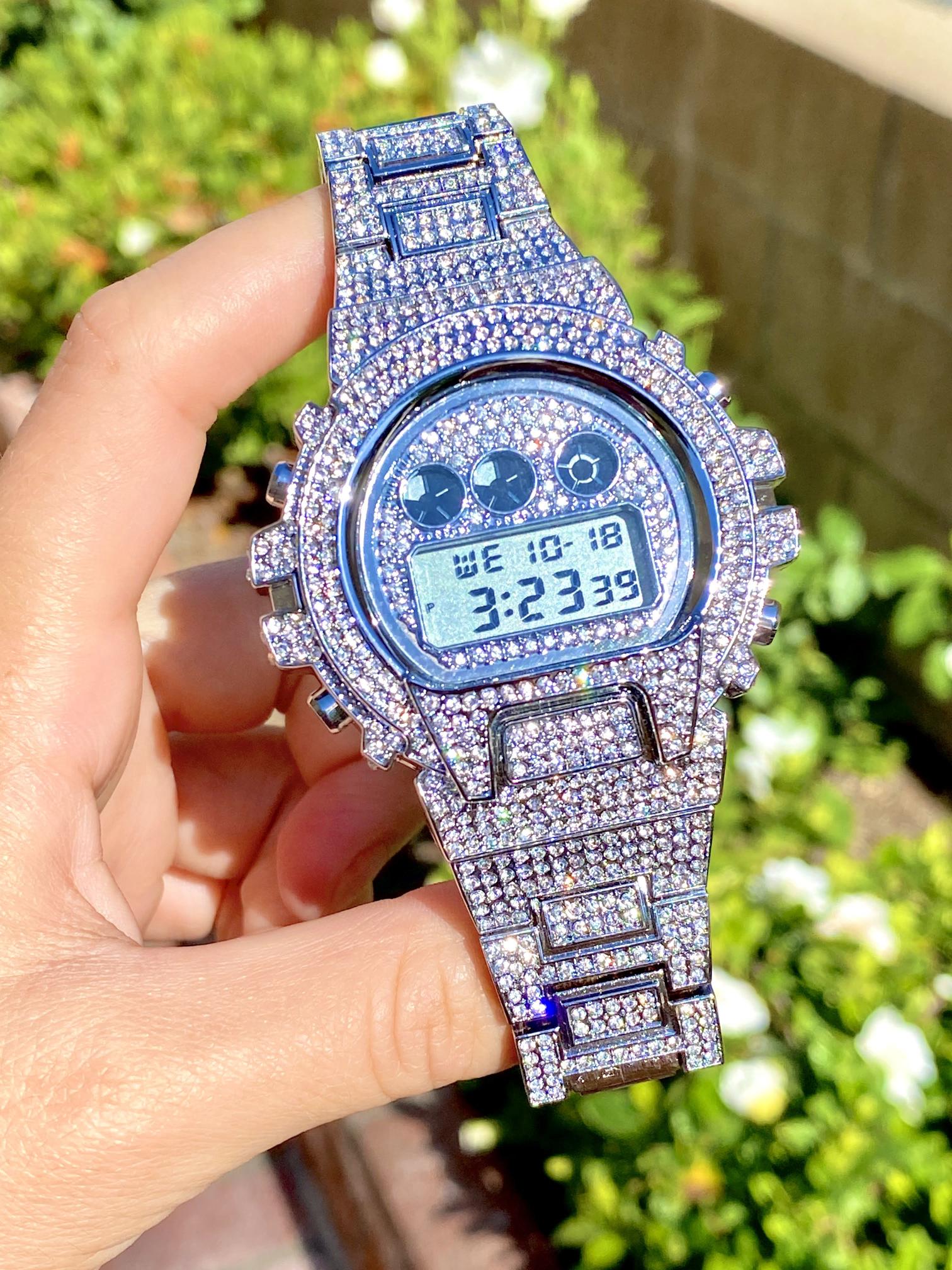 Silver iced-out digital watch with full pavé bezel and bracelet – luxury tech streetwear style