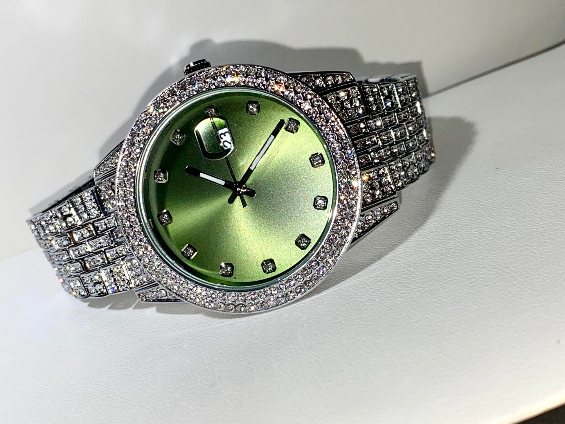 Silver iced-out watch with mint green dial and pavé bracelet – luxury streetwear style