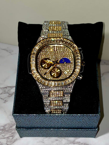 Two-tone iced-out watch with gold dial, moon phase complication, and baguette bezel – luxury diamond timepiece