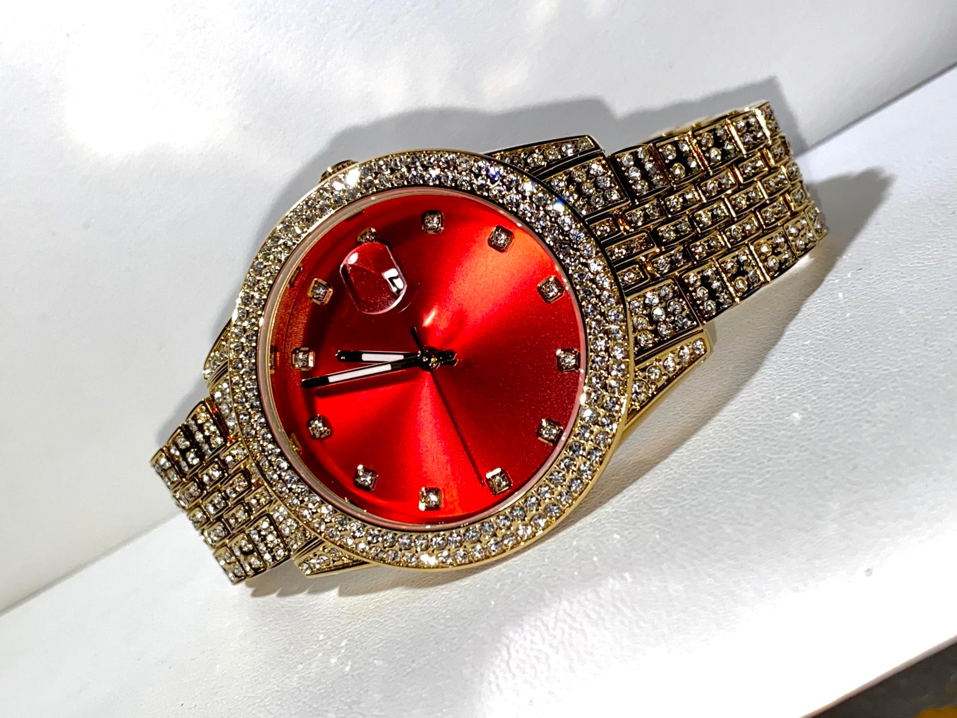 Iced gold watch with red dial on satin background – Red Royale 42MM by Time Flex