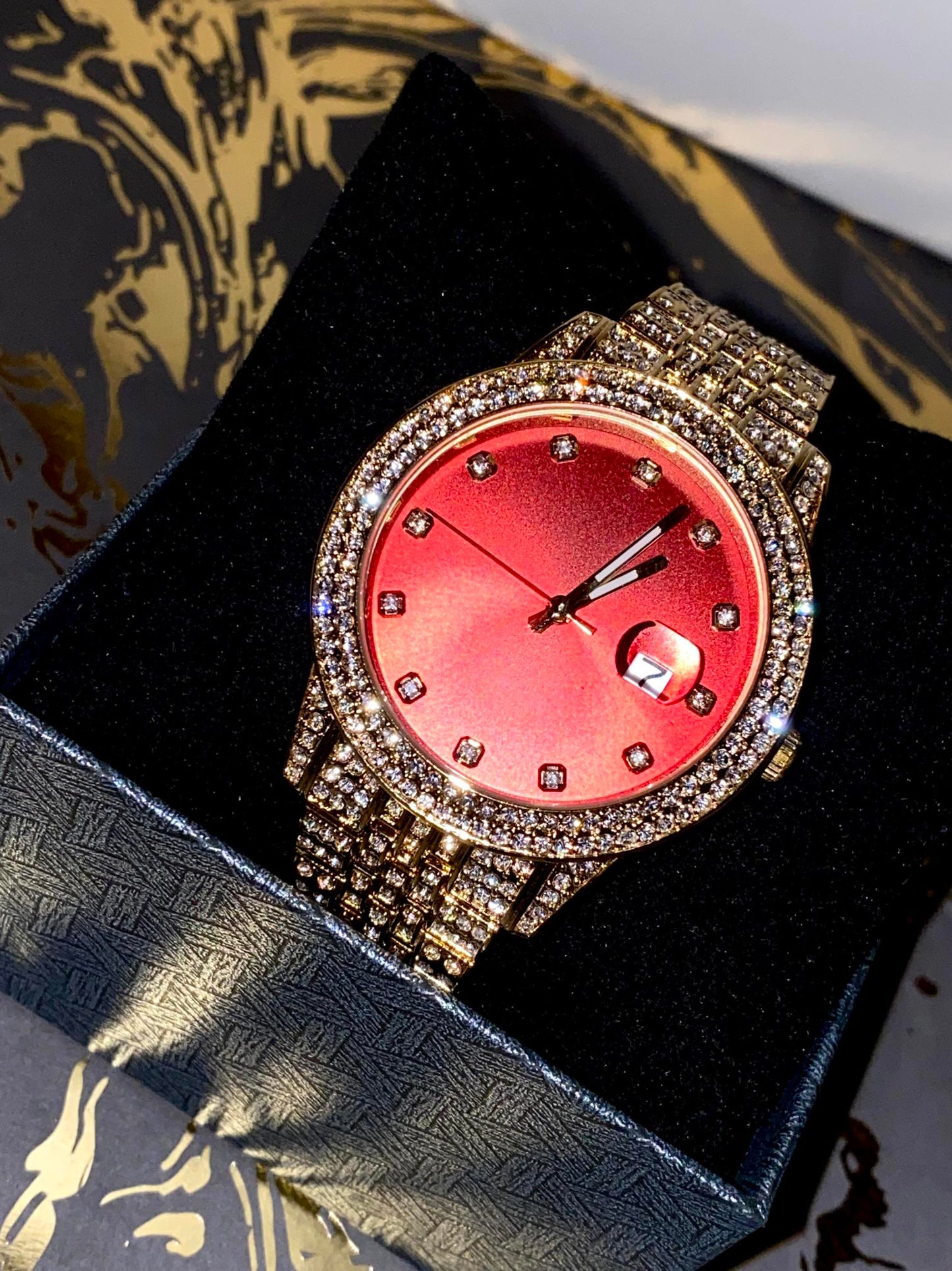 Iced gold watch with red dial on satin background – Red Royale 42MM by Time Flex