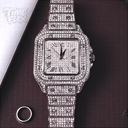 Silver-tone unisex watch with a square dial, crystal-encrusted bezel, and sparkling band. The watch features Roman numeral markers and a luxurious, diamond-studded design, offering a sleek and elegant look.
