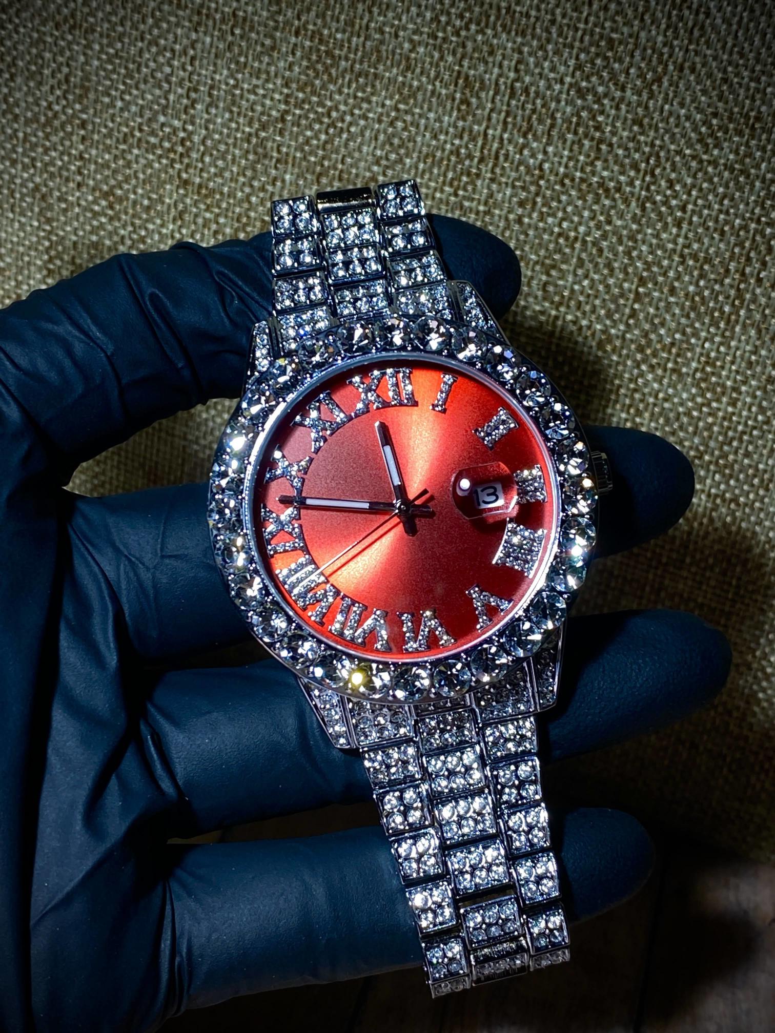 Red dial Roman numeral iced-out watch with crystal bezel and silver pavé band – luxury statement accessory