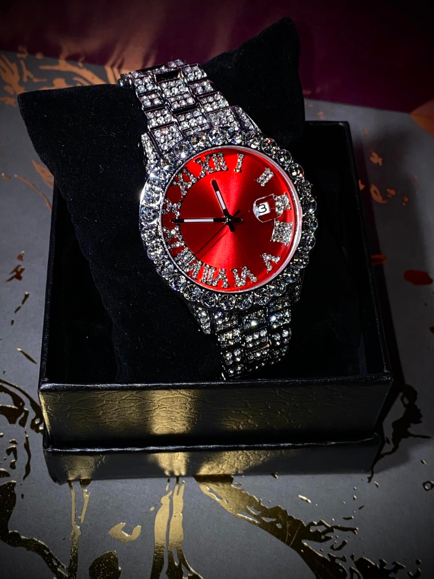 Red dial Roman numeral iced-out watch with crystal bezel and silver pavé band – luxury statement accessory