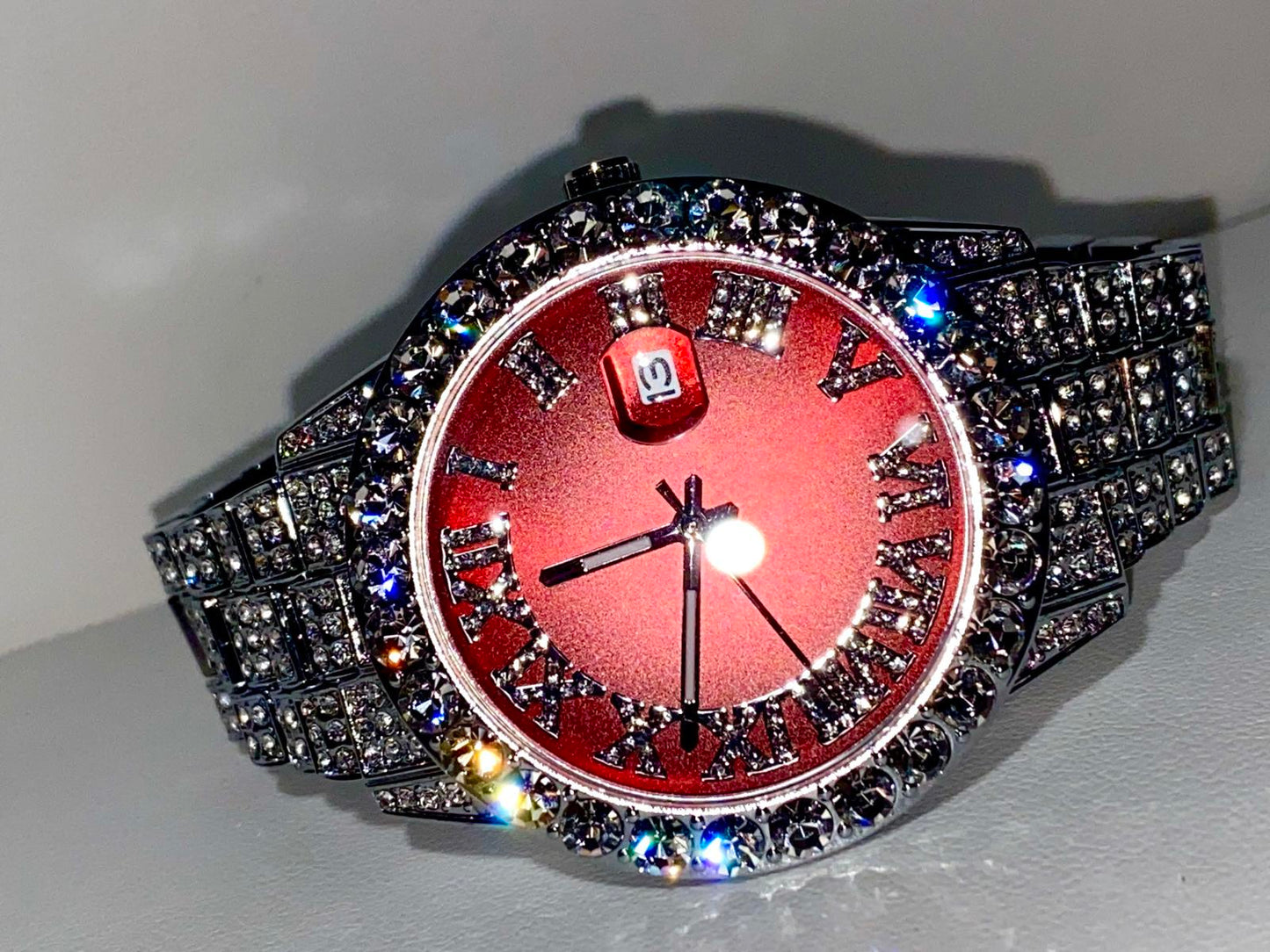 Red dial Roman numeral iced-out watch with crystal bezel and silver pavé band – luxury statement accessory