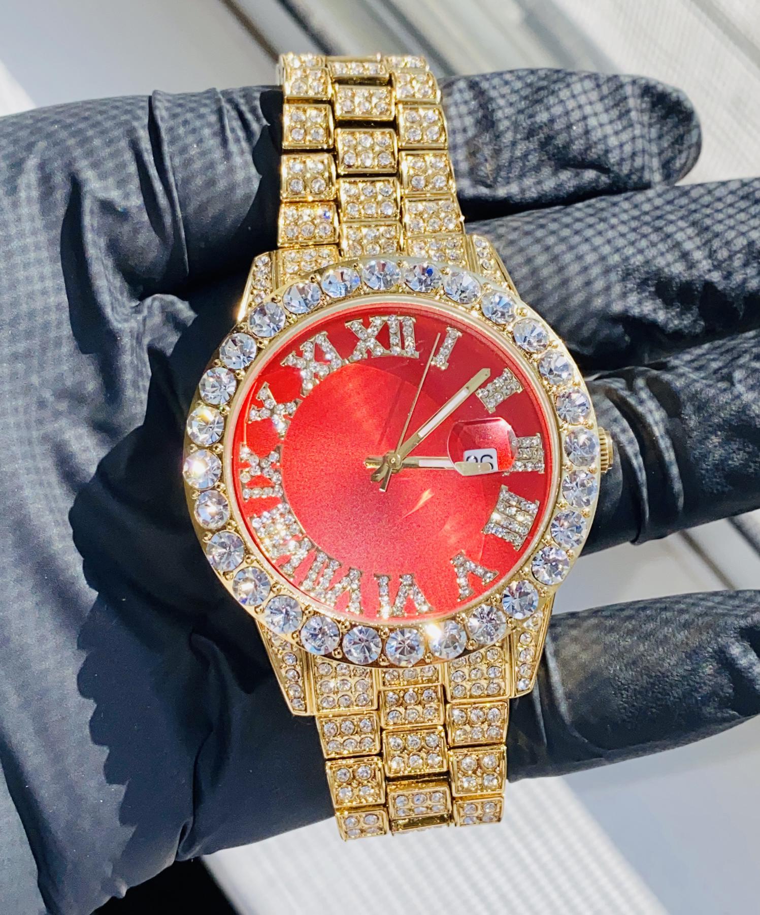 Gold iced-out watch with scarlet red dial, Roman numerals, and diamond bracelet – luxury streetwear timepiece