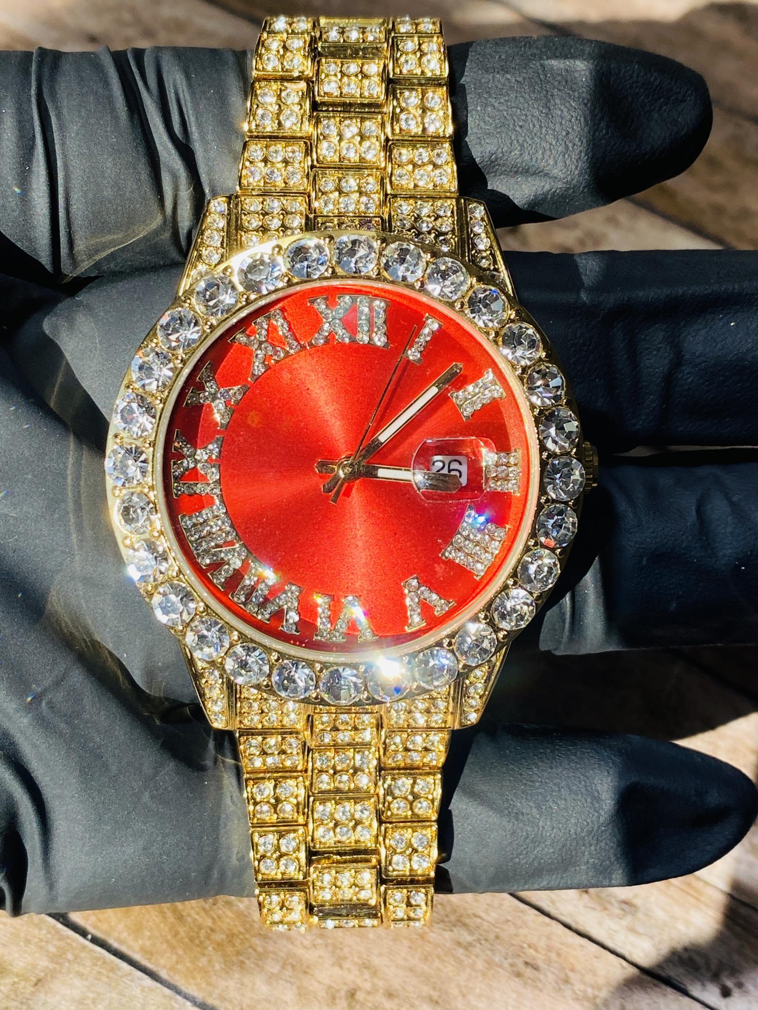 Gold iced-out watch with scarlet red dial, Roman numerals, and diamond bracelet – luxury streetwear timepiece