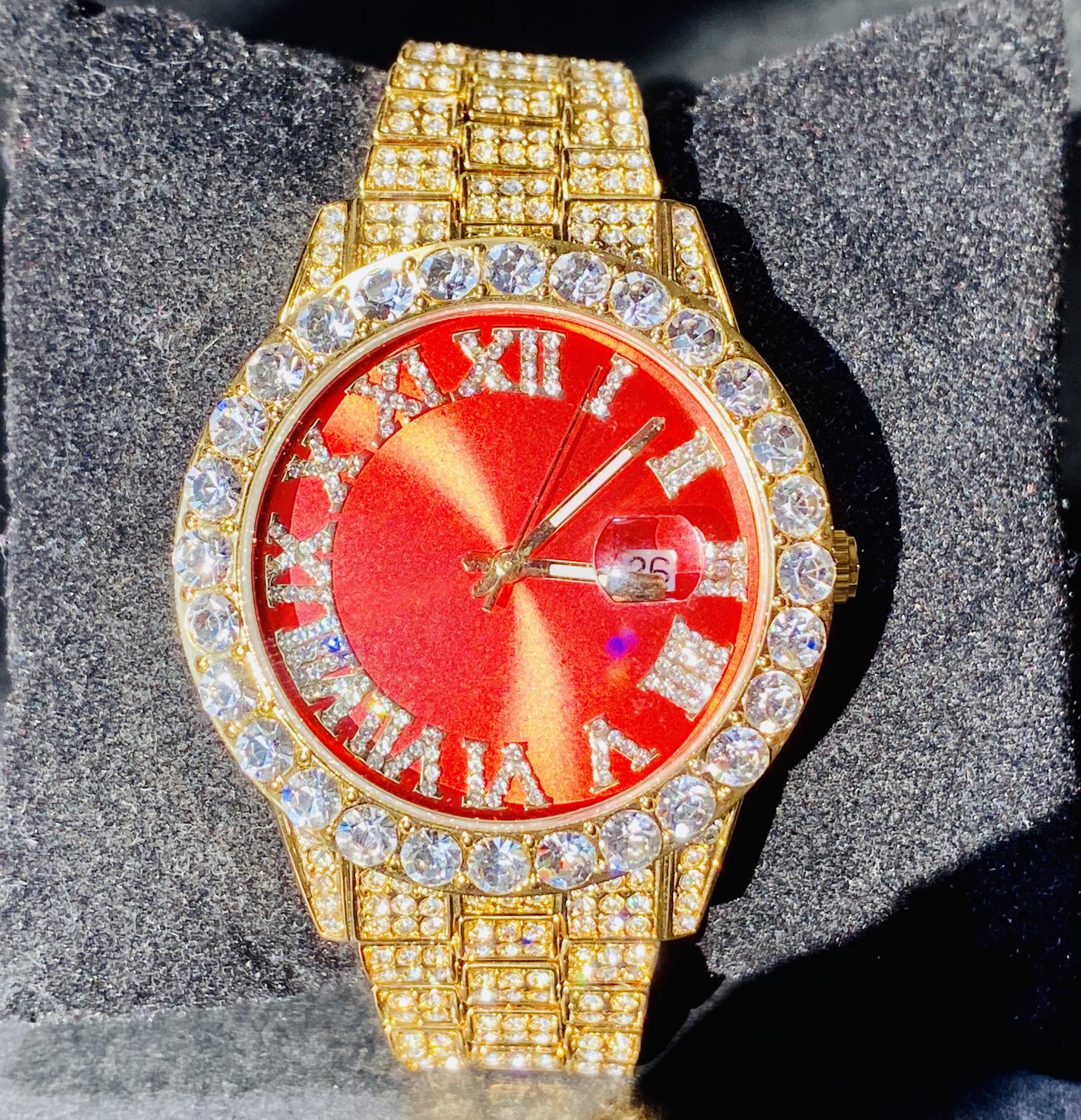 Gold iced-out watch with scarlet red dial, Roman numerals, and diamond bracelet – luxury streetwear timepiece
