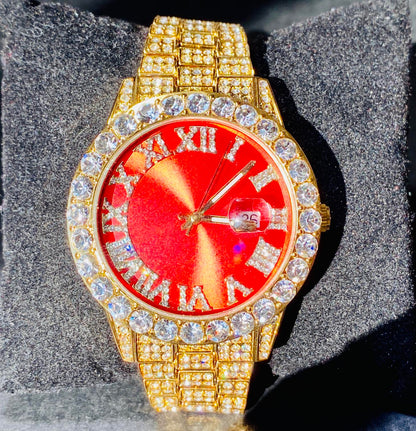 Gold iced-out watch with scarlet red dial, Roman numerals, and diamond bracelet – luxury streetwear timepiece