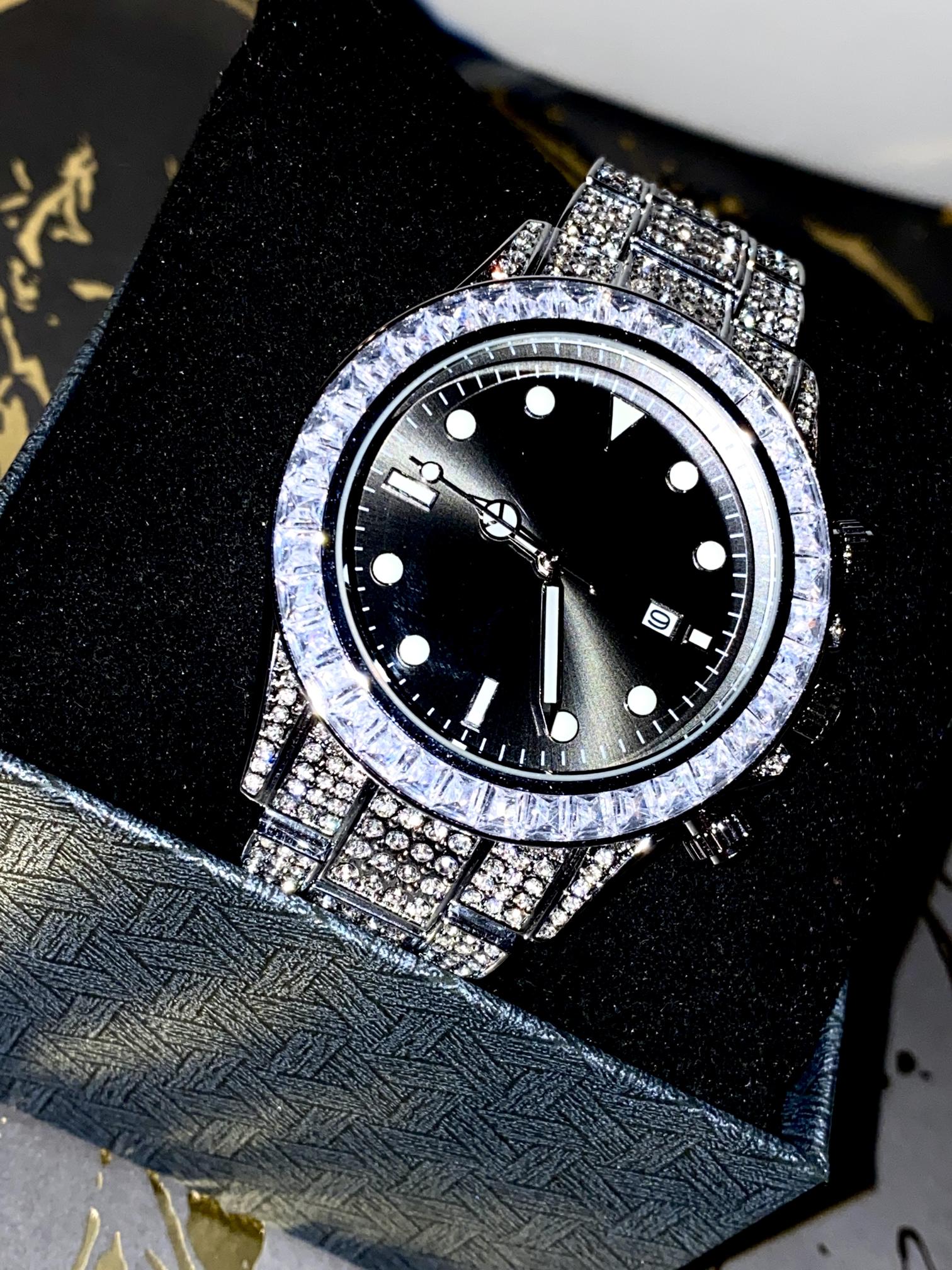 Silver iced chronograph watch with black dial displayed on white ceramic cuff – ShadowFlex 42MM by Time Flex