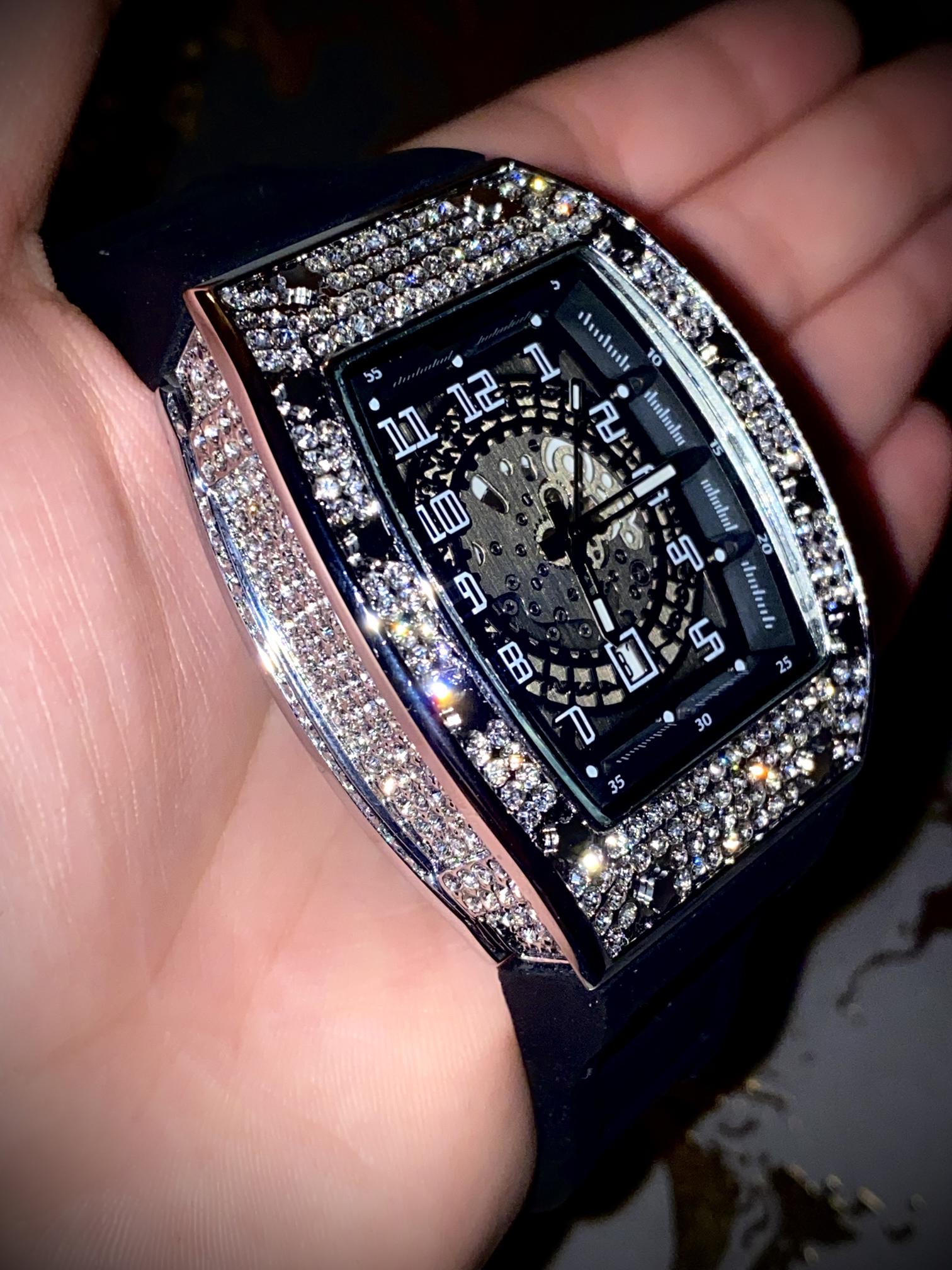 Black iced-out barrel watch with skeleton dial and rubber strap – luxury streetwear style