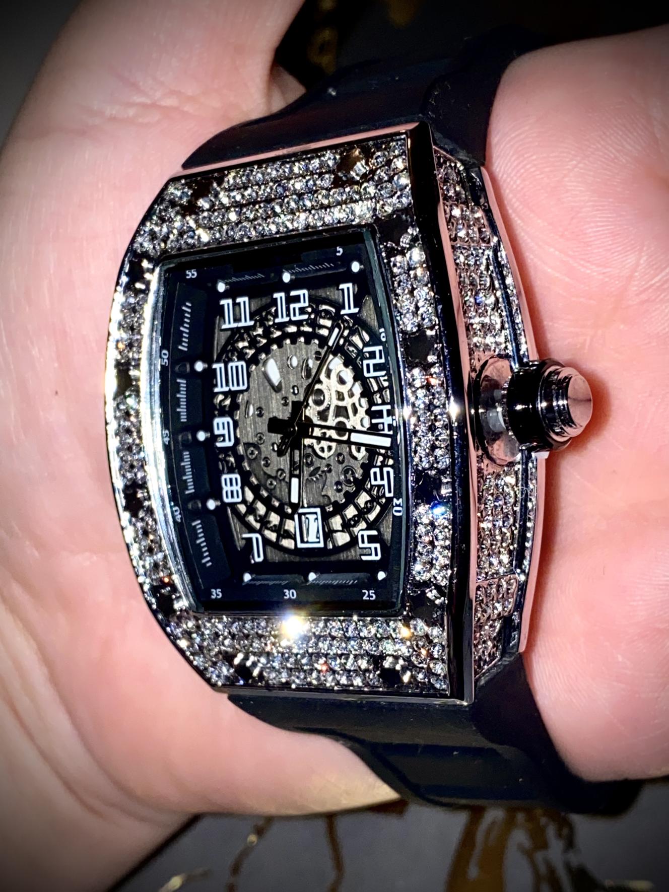 Black iced-out barrel watch with skeleton dial and rubber strap – luxury streetwear style