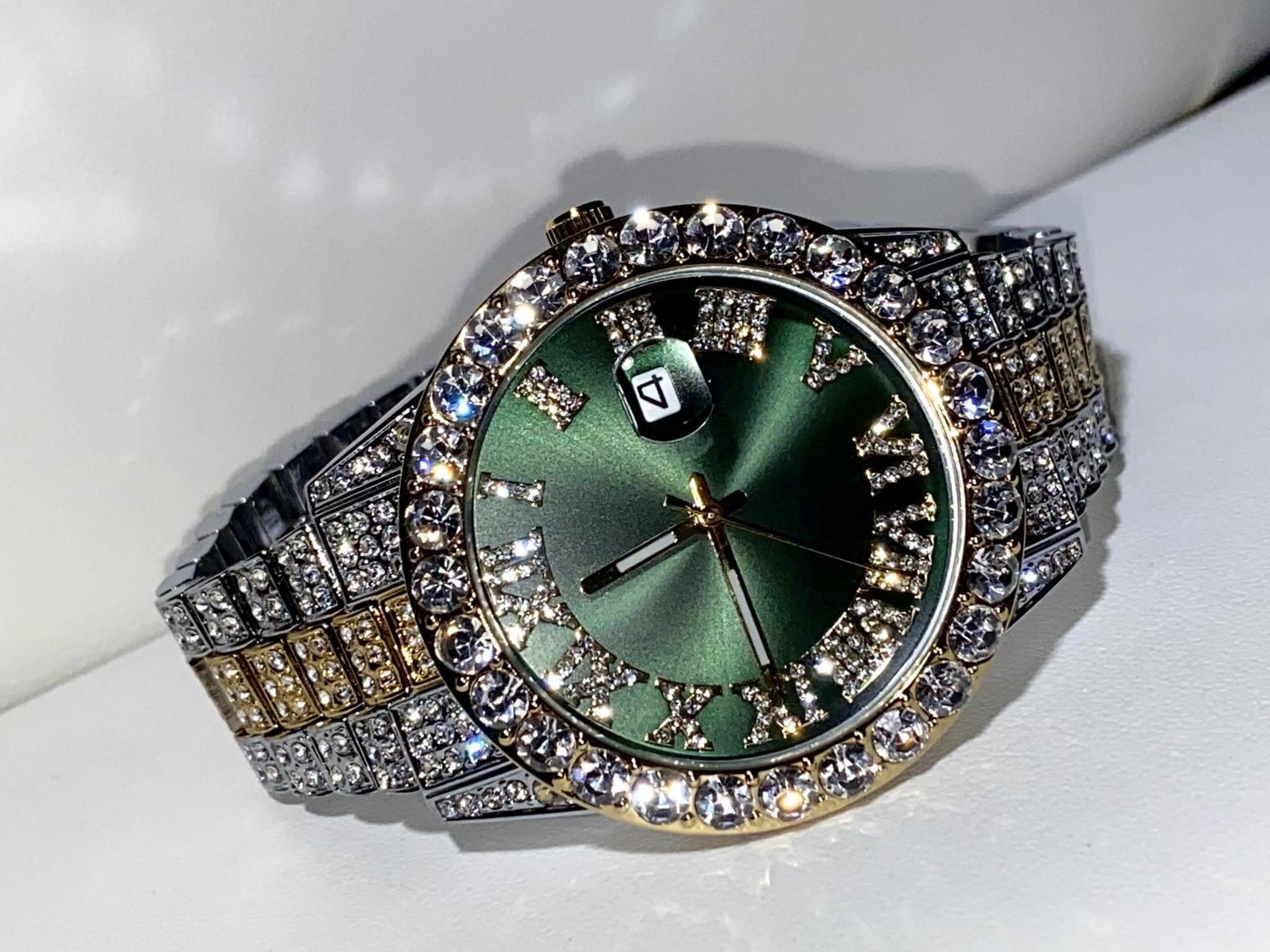 Two-tone iced-out watch with green Roman numeral dial and crystal bezel – luxury statement timepiece