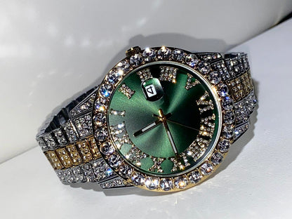 Two-tone iced-out watch with green Roman numeral dial and crystal bezel – luxury statement timepiece