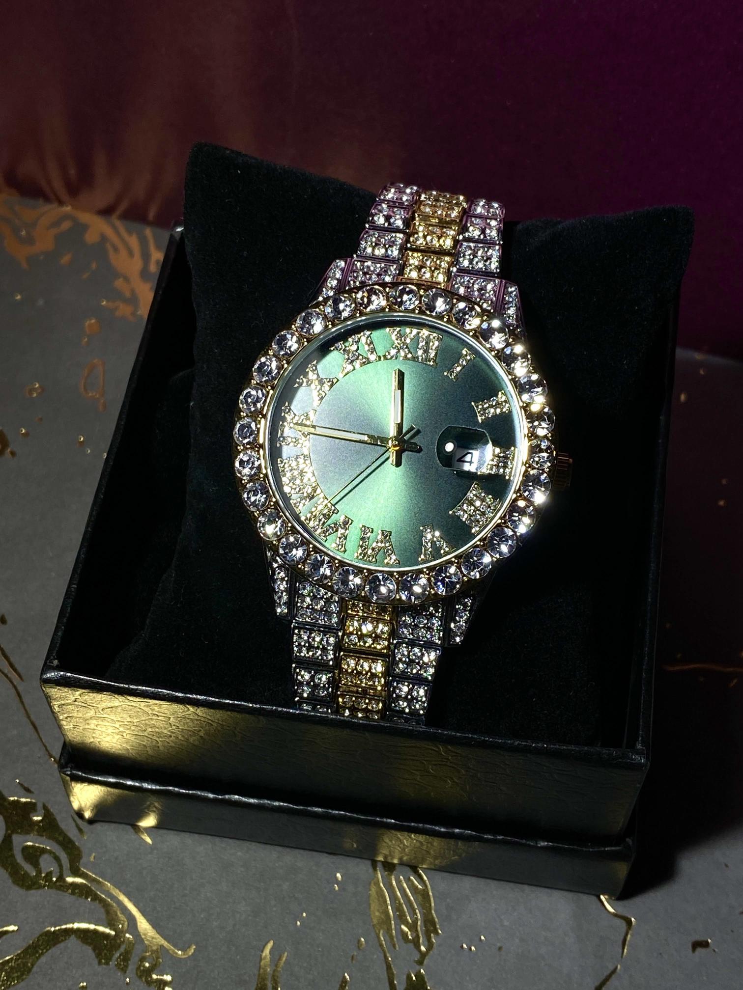 Two-tone iced-out watch with green Roman numeral dial and crystal bezel – luxury statement timepiece