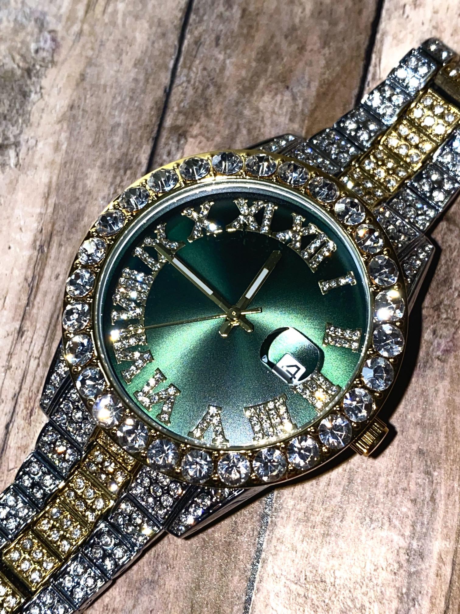 Two-tone iced-out watch with green Roman numeral dial and crystal bezel – luxury statement timepiece