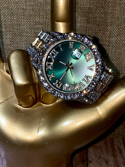Two-tone iced-out watch with green Roman numeral dial and crystal bezel – luxury statement timepiece